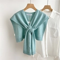 Close-up of mint green knitted wool shawl with knot design on white shirt - Mint Green