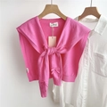 Close-up of pink knitted bow shawl styled over a white shirt with detailed ribbon tie - 42*94cm / Peach Pink