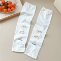Detailed view of white cooling ice silk arm sleeves featuring cute cartoon animal prints - 13 Deer Bear Elephant