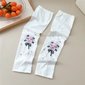 Close-up of white sun protection sleeves with cute cartoon print and drawstring detail - 16 Heart Bow Balloon