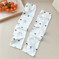 Detail view of white cooling arm sleeves with cute cartoon patterns and black bow design - 19 Minimalist Bow Big Ear Rabbit