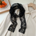 Detail of delicate black lace scarf with floral embroidery and cursive letter detailing - Flat Edge Lace / 130cmx6cm / Star Flower Black