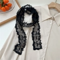 Detail of black lace scarf with floral embroidery and lettering on beige fabric - Flat Edge Lace / 130cmx6cm / Five-Petal Flower Black