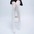 Close-up of white ribbed knit over-knee thigh high socks with elastic vertical texture - White