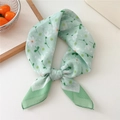 Light green cotton linen scarf with daisy print tied in a minimalist elegant knot - Green Small Daisy (45B)
