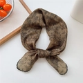 Brown vintage floral scarf with black lace trim tied in an elegant knot on white backdrop - Camel Dotted Leaf
