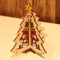 3D wooden Christmas tree ornament with carved snowman scene and yellow star topper - Wooden Christmas Tree