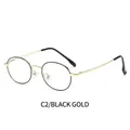 Gafas anti luz azul con montura ovalada de metal en color negro y dorado fino - Montura Oro Negro