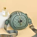 Round sage green quilted crossbody bag with a cute cat pendant and jacquard strap - Green