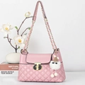 Pink quilted crossbody bag with golden T-shaped lock and cute fuzzy charm pendant - Pink
