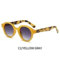 Ovale gele schildpad zonnebril met grijze gradiënt glazen en zilveren klinknagel details - Geel Frame Schildpad Tempel Grijs Verloop Lenzen