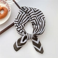 Brown and white geometric striped silk scarf tied in a neat bow on a minimalist desk - 15SR-Maze Stripe Chestnut