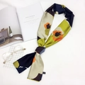 Detail of floral silk scarf styled with magazine and golden glasses for elegant lifestyle - Floral Patchwork