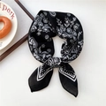 Retro black paisley silk scarf with white floral patterns tied in a circular loop - Dotted Black Paisley (09SR)