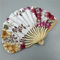 Close-up of a Japanese folding fan with bamboo ribs and colorful floral fabric patterns - No.14 Red Flower Vine