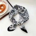 Black and white paisley pattern silk scarf tied in a stylish knot on a white background - 29SR-Small Paisley Clover Beige