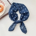 Navy blue silk-like square scarf with white floral and paisley patterns in a knot tie - Disk Paisley Blue (23SR)
