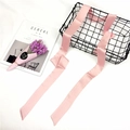 Pink satin narrow scarf draped on wire basket with elegant floral and magazine accents - Pink / 4-195cm