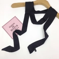 Minimalist long black satin skinny scarf for women with elegant silky finish - Black