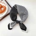Elegant black and white striped silk scarf tied in a bow on a minimalist background - Diagonal Contrast Black White (36SR)