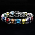 Elegant silver bracelet with multi-colored oval gemstones and white zircon accents - Colorful