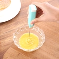 Electric handheld milk frother and egg whisker with stainless steel head in action - Blue Box