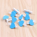 Mini wooden photo clips with blue heart decoration scattered on a rustic wooden background - Sky Blue