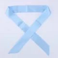 Detailed view of the sky blue satin skinny scarf tied around a handbag handle - 100x4cm / Sky Blue