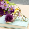 Golden high heel keychain with purple rhinestones and a soft purple fur pompom - Plush High Heels Purple