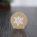 Round khaki Christmas gift tag featuring white snowflake pattern with hanging hole - Round Yellow with White Snowflake (100Pcs)