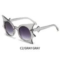 Unique bat wing shaped sunglasses with grey frame and purple-grey gradient lenses - Transparent Grey Frame Gradient Grey Lens