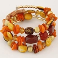 Detail of bohemian layered wrap bracelet with orange shells and beaded crystal accents - Orange