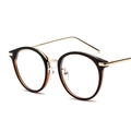 Retro round black and gold frame glasses with metal temples in a 3/4 side view - Gold Frame Tea Edge C5