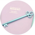 Creative blue key-shaped gel pen resting on a soft pink decorative round object - Lake Blue-Triple Ring Key