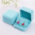Detail view of heart-shaped red crystal earrings inside blue velvet jewelry boxes - 70*70*40mm / Sky Blue