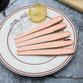 5-piece rose gold stainless steel dessert fork set on a ceramic plate with lemon - 410 Stainless Steel Spoon - Rose Gold