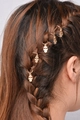 Macro shot of five golden Hamsa hand charms on a braided hairstyle for DIY hair styling - Gold Hamsa / Gold