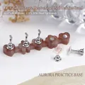 Macro shot of heart shaped agate nail display base with magnetic metal holder - Brown Faux Agate
