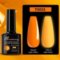 Macro view showing orange fluorescent nail polish glowing orange in the dark - Fluorescent Glow Gel TS031 (Orange Yellow)