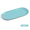 Close-up of a sky blue oval stainless steel organizer tray with a smooth glossy finish - Blue