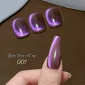Macro detail of Blue Tears cat eye nail tips in sparkling purple-pink 001 finish - Blue Tears Cat Eye Gel 01 (Purple Pink)
