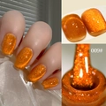 Detailansicht von 009 hellorangefarbenem Cat-Eye-Nagellack mit Glitzer und Pinseltextur - Traumhaftes Lichtjagendes Katzenaugen-Gel 09