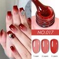 Deep red gel nail polish NO.017 showing 1 to 3 layers of opacity and rhinestone decor - Iced Translucent Gel 17