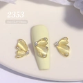 Macro view of butterfly nail charms with cat-eye stone and rhinestones, size 12.4x14mm - Yellow Cat's Eye Butterfly(2353)