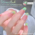 Macro shot of C003 cat eye nail polish with pink base and green shimmering magnetic effect - Double Light Cat Eye / Qian Sui / Green Pink Polarized (03)