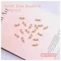 Macro detail of apricot bow nail art charms with silver pearl accents on soft backdrop - Apricot Bowknot (2505) / 8*3.5mm