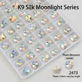 Macro detail of plum blossom K9 glass nail art crystal in iridescent aurora finish - Plum Blossom (8*8mm)