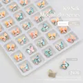 Detailed view of K9 butterfly nail crystals with aurora finish in a white organizer tray - Butterfly (7.2*7.9mm)