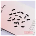 Detail view of black ballet ribbon bowknot nail charms with silver beads on pink background - Black Bowknot (2511) / 8*3.5mm