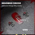 Gothic skull nail charm with red zircon in gun black finish for Halloween nail art - Skull Cross Style (2422)